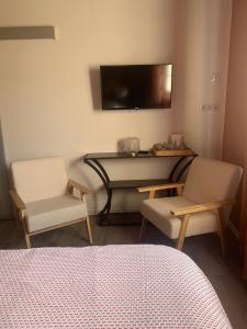 TV a/nebo společenská místnost v ubytování la bastilac chambre terracotta