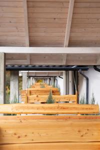 a row of wooden benches in a church at Mizhhirya resort in Mizhhirya
