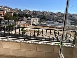 a view of a city from a balcony at 2 Bedroom apartment in Jerash Centre in Jerash
