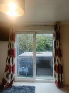 Ένα ή περισσότερα κρεβάτια σε δωμάτιο στο Willow Lodge