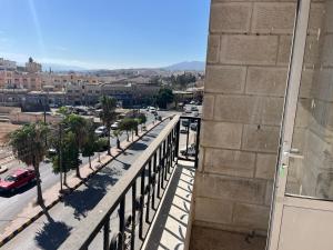 a view of a city from a balcony of a building at 2 Bedroom apartment in Jerash Centre in Jerash +6 photos