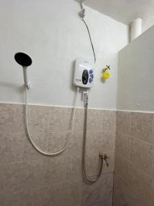 a shower in a bathroom with a shower at Santai DPermai Homestay in Selama +53 photos
