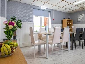 a dining room with a table and chairs at The Ascot in Blackpool +34 photos