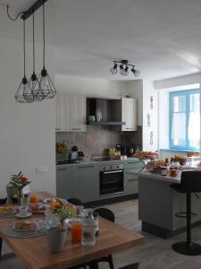 a kitchen with a table with food on it at B&B Stella d'Oro in Vezzano