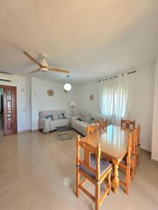 a living room with a table and a couch at Brisa MarinaTerraza Vistas a la Isla Free Parking in Carboneras