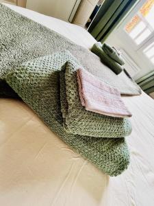 Ένα ή περισσότερα κρεβάτια σε δωμάτιο στο Le Clos du Green