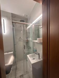 a bathroom with a shower and a sink at Bloem in Komotini +28 photos
