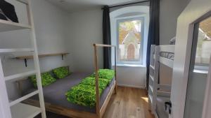 a small room with bunk beds and a window at Šumavská pohoda Zdíkovec 21 in Zdíkov