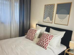 a bedroom with a bed with pillows on it at Aegean green retreat in Kavala