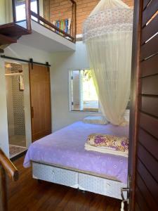 Ένα ή περισσότερα κρεβάτια σε δωμάτιο στο Vila Ita Rock