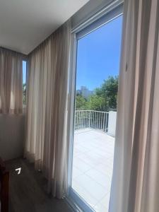 Balkón nebo terasa v ubytování Triplex con 3 dormitorios, terraza y cochera