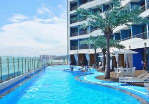 a swimming pool on the side of a building at Nova Stay Gangneung in Chumunjin