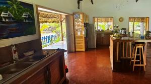 a kitchen with a sink and a counter top at La Vie Est Belle in Ambaro