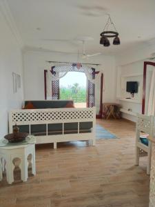 a living room with a couch and a table at Villa Quiet Place in Luxor
