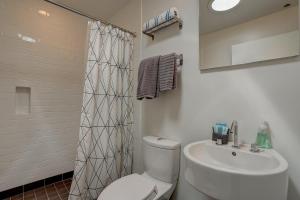 a bathroom with a white toilet and a sink at Neal Creek Retreat in Mount Hood +34 photos
