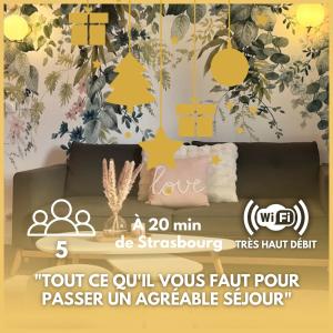 a poster of a living room with a couch and a tree at Le Printemps 