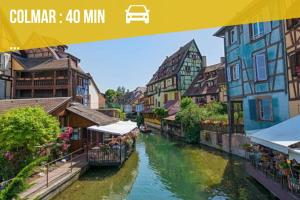a picture of a river in a city with buildings at Le Printemps 
