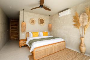 a bedroom with a bed and a ceiling fan at Stunning Koh Samui Villa with Infinity Pool & Ocean View "Villa Sabaï Dii" in Koh Samui +34 photos