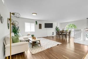 a living room with a couch and a table at Bright and chic home with a cozy touch in Windsor