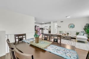 a dining room and living room with a table and chairs at Bright and chic home with a cozy touch in Windsor