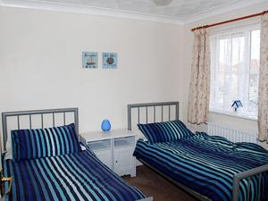 Postel nebo postele na pokoji v ubytování Sea Breeze Bungalow