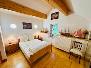 Ένα ή περισσότερα κρεβάτια σε δωμάτιο στο L'échappée belle - Maison entière - Marmagne