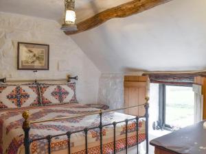 a bedroom with a bed in a room at Threshing Barn - Kza in Glaisdale +13 photos