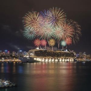 a cruise ship with fireworks on the water at Apartamento Maravilhoso 2 Quartos Suíte Privativa no Boqueirão em Santos in Santos