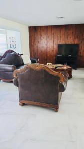 a leather couch sitting in a living room at My Relaxing place! in North Fort Myers