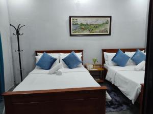 Postel nebo postele na pokoji v ubytování Goldland Caelestis Guest House