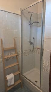 a bathroom with a shower with a glass door at Casa Adelaide - A stone's throw from Rome in Gavignano