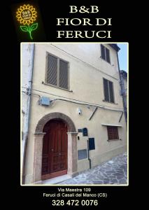 a building with a door and a sign that reads best flood fund at B&B Fior di Feruci 