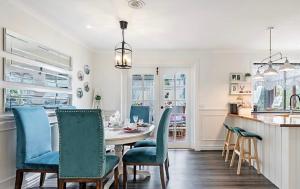 a kitchen and dining room with a table and chairs at Home of Susan Close in Narre Warren +13 photos