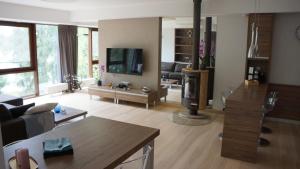 a living room with a couch and a tv at Mierki da Marco 