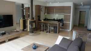 a living room with a couch and a kitchen at Mierki da Marco 