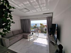 a living room with a couch and a balcony at Luxuery View in Calpe
