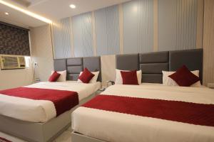 Ένα ή περισσότερα κρεβάτια σε δωμάτιο στο HOTEL CRESTA INN ,Agra
