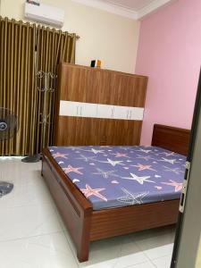 Ένα ή περισσότερα κρεβάτια σε δωμάτιο στο Căn Hộ Phương Anh