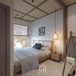 a bedroom with a bed and a window at Du già ecolodge in Yên Minh