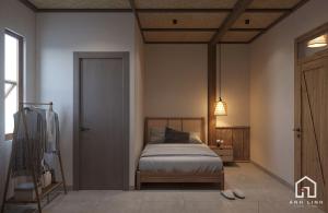 a bedroom with a bed in the corner of a room at Du già ecolodge in Yên Minh