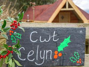 a chalkboard sign with a cut autumn written on it at Cwt Celyn Qu7605 in Llangernyw