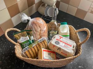 a basket filled with food on top of a counter at Pipit Cottage in Burnsall