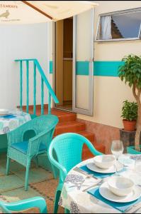 a patio with a table and chairs and a window at Maspalomas Pasito Blanco N in Pasito Blanco