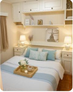 a bedroom with a bed with a tray on it at Maspalomas Pasito Blanco N in Pasito Blanco +24 photos