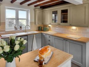 a kitchen with a loaf of bread on a counter at Brompton Lodge in Ganton