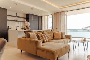 a living room with a couch and a table at Nusa Apartments Monte Cara in Mindelo +14 photos
