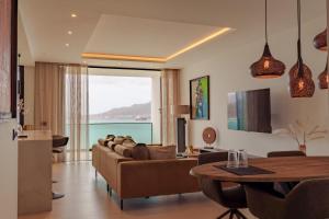 a living room with a couch and a table at Nusa Apartments Monte Cara in Mindelo
