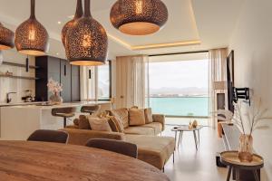 a living room with a couch and a table at Nusa Apartments Monte Cara in Mindelo