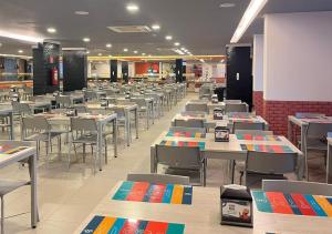 a dining room with tables and chairs in a restaurant at Enjoy olimpia park resort in Olímpia +8 photos