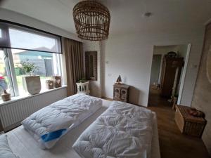 Ένα ή περισσότερα κρεβάτια σε δωμάτιο στο B&B Aan de Hoge Berg +9 φωτογραφίες